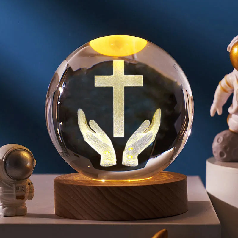White crystal ball desk ornament with wood base and religious design inside