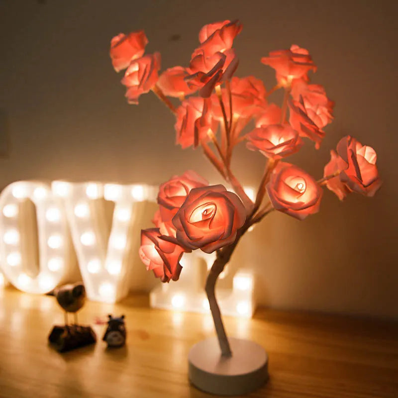 White and red rose flower LED table lamp with bonsai tree lights on a table.