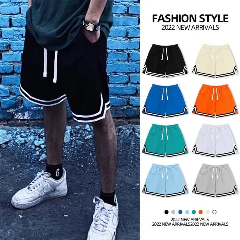 Man wearing loose-fit black polyester sports shorts for summer leisure activities.