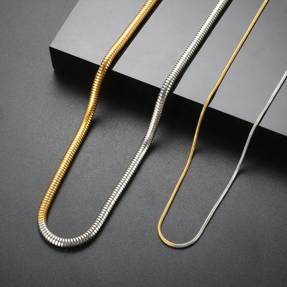 Gold-toned stainless steel snake bone chain necklace for women, 3mm wide.
