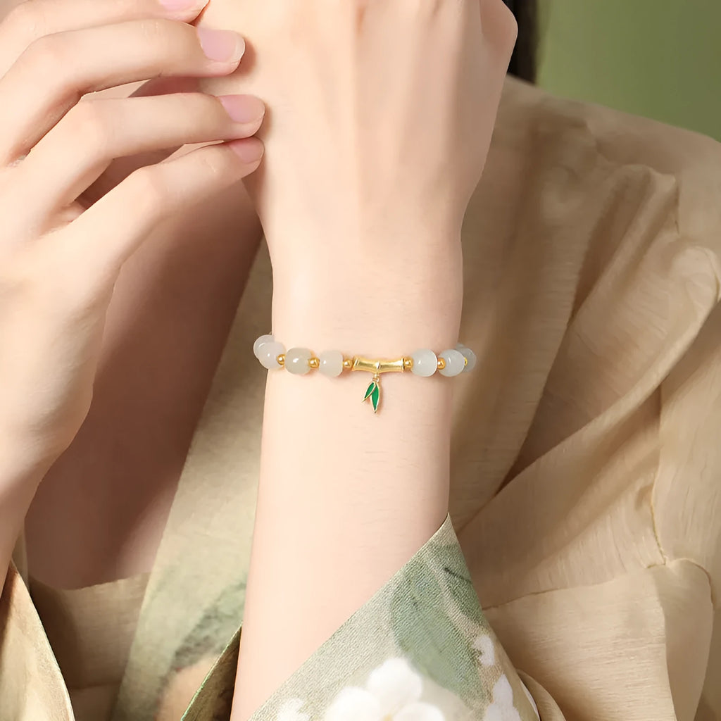 Women's S925 sterling silver and Hetian jade bracelet with bamboo leaf design.