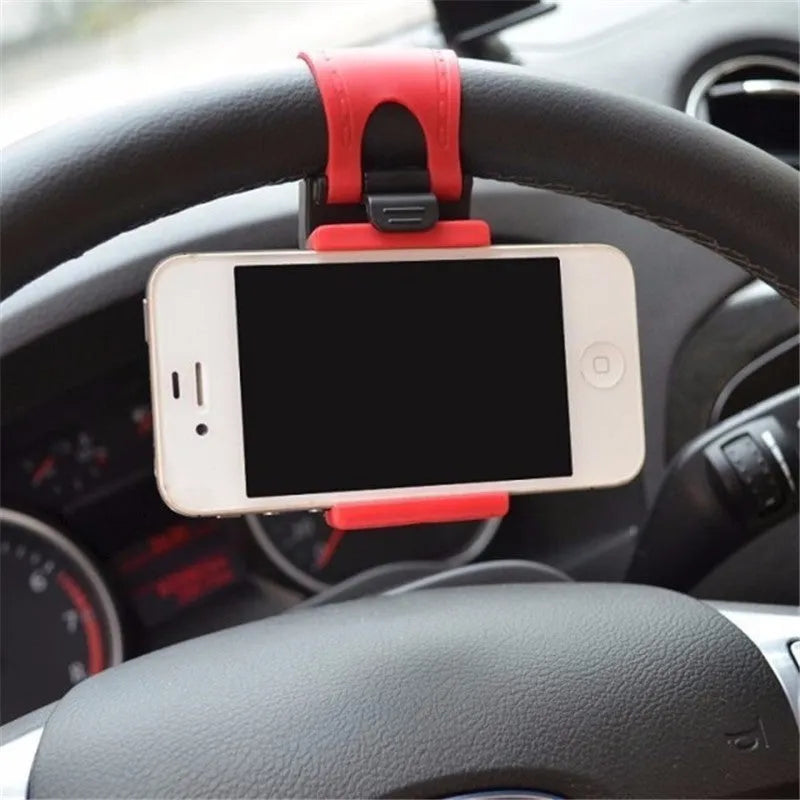 Black universal steering wheel phone clip holder mounted with a smartphone displaying a map.