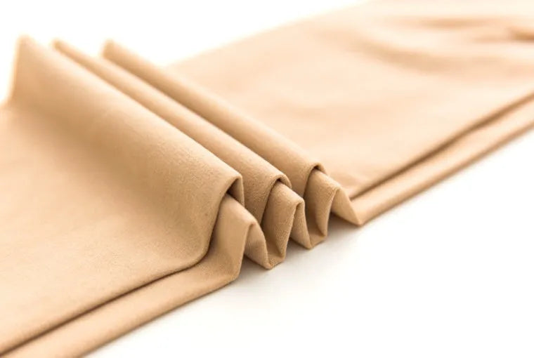 Beige and black stovepipe shapewear socks for hip and abdomen lifting support