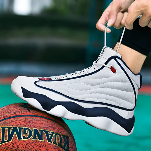High-top basketball shoes with thick rubber soles and mesh uppers in AJ13 white red colourway