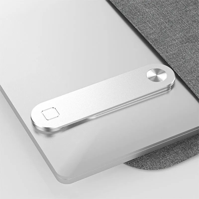 Black aluminium laptop phone holder with magnetic clip mounted to side of monitor