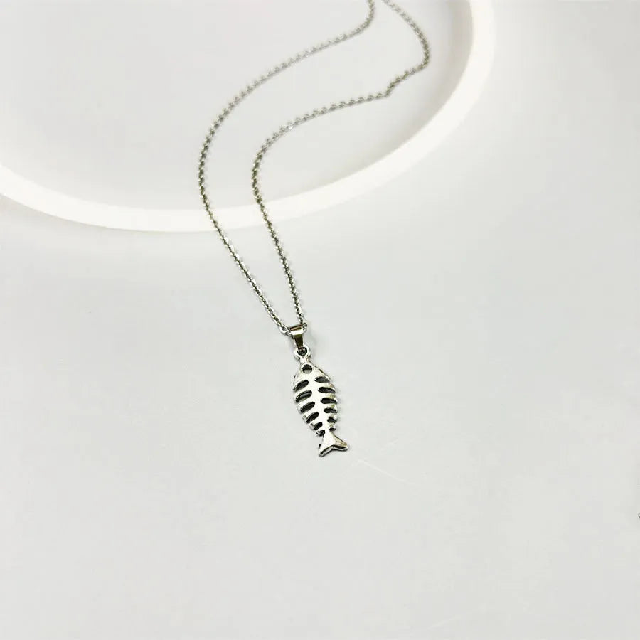 Retro fishbone pendant necklace and earrings set with adjustable alloy chain on a white background