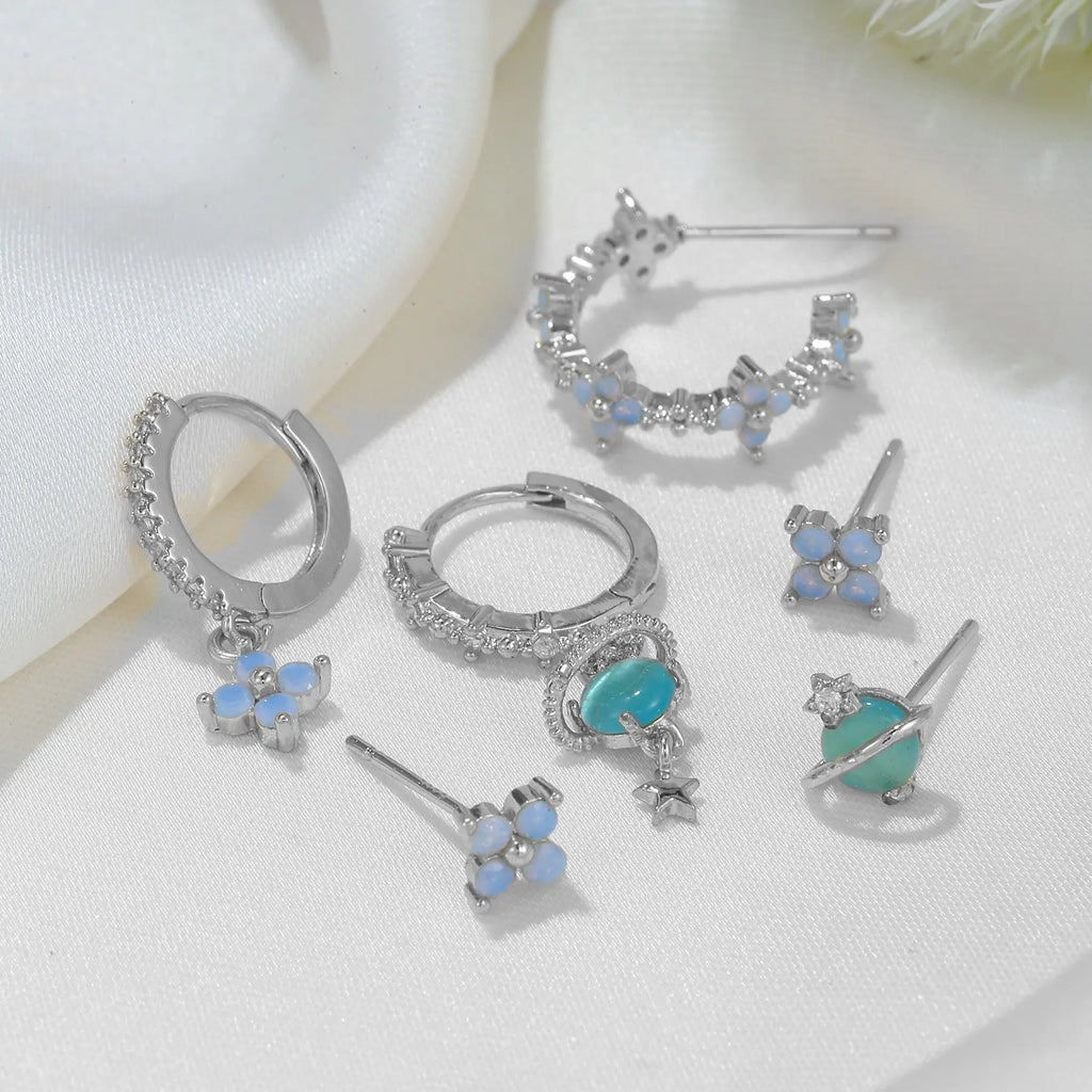 Blue protein colour flower nail design earrings with zircon accents in gold and silver options