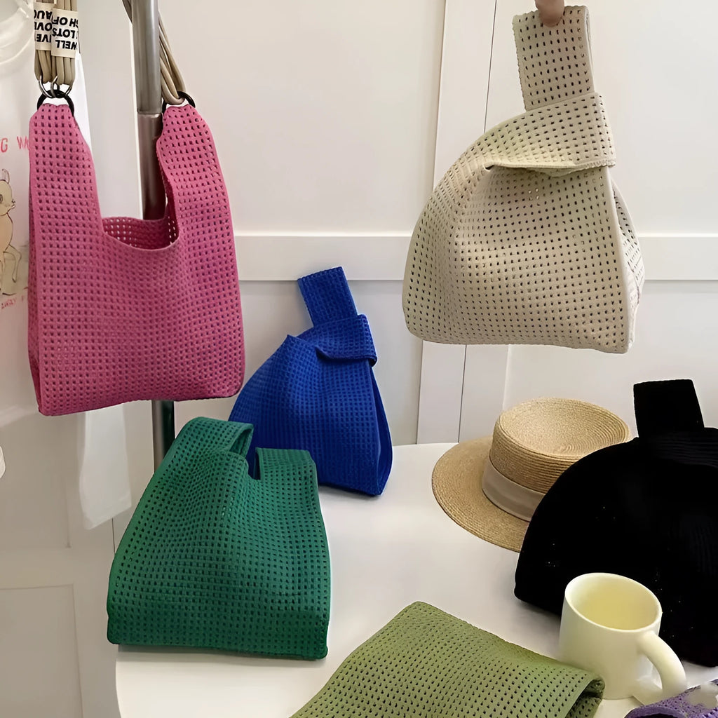 Soft polyester hollow knitted handbag for women with open-weave texture, shown in one of nine colour options