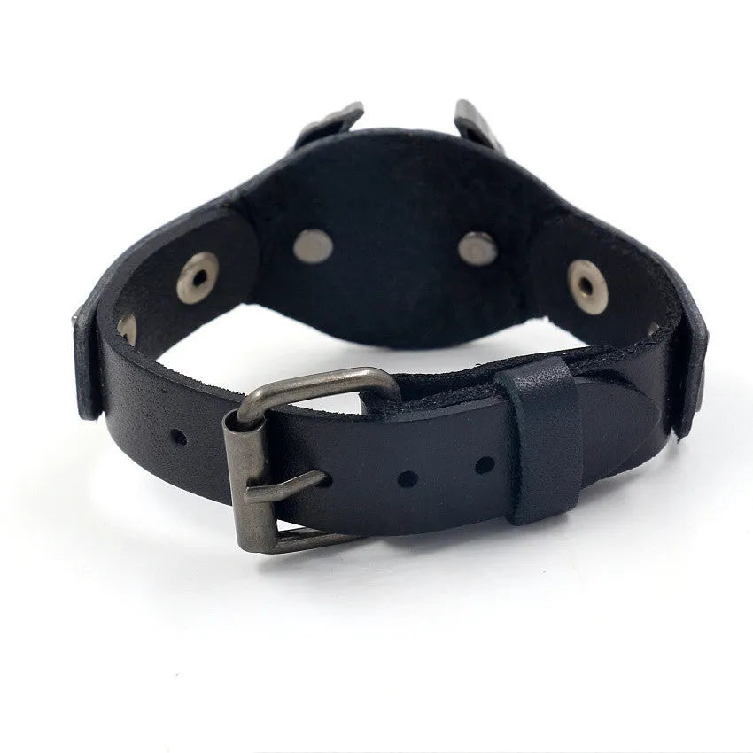 Black geometric leather bracelet with an alloy eagle watch-button clasp, shown flat displaying its 26cm length.