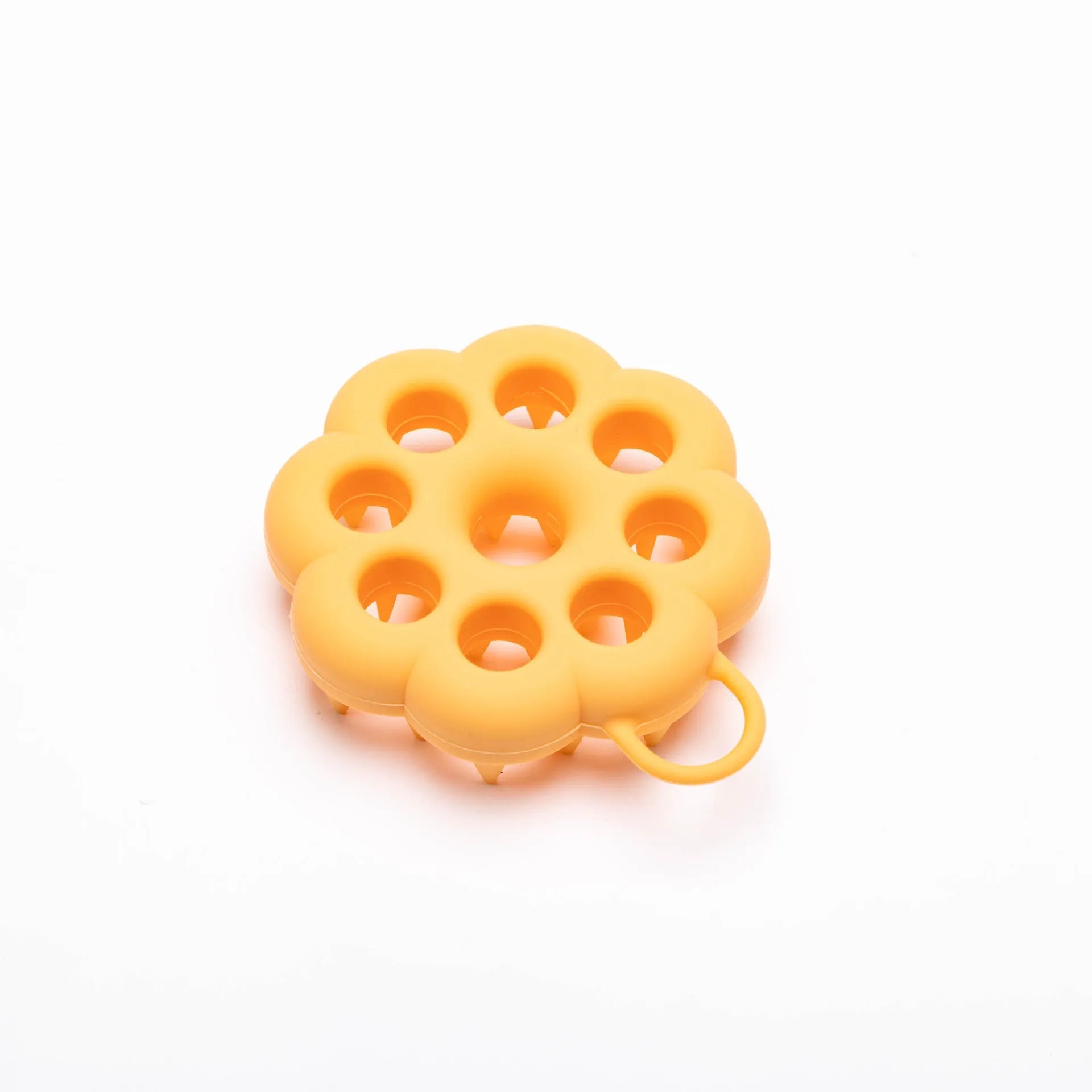 Blue silicone pet grooming brush with soft bristles and an ergonomic massage handle on a white background.