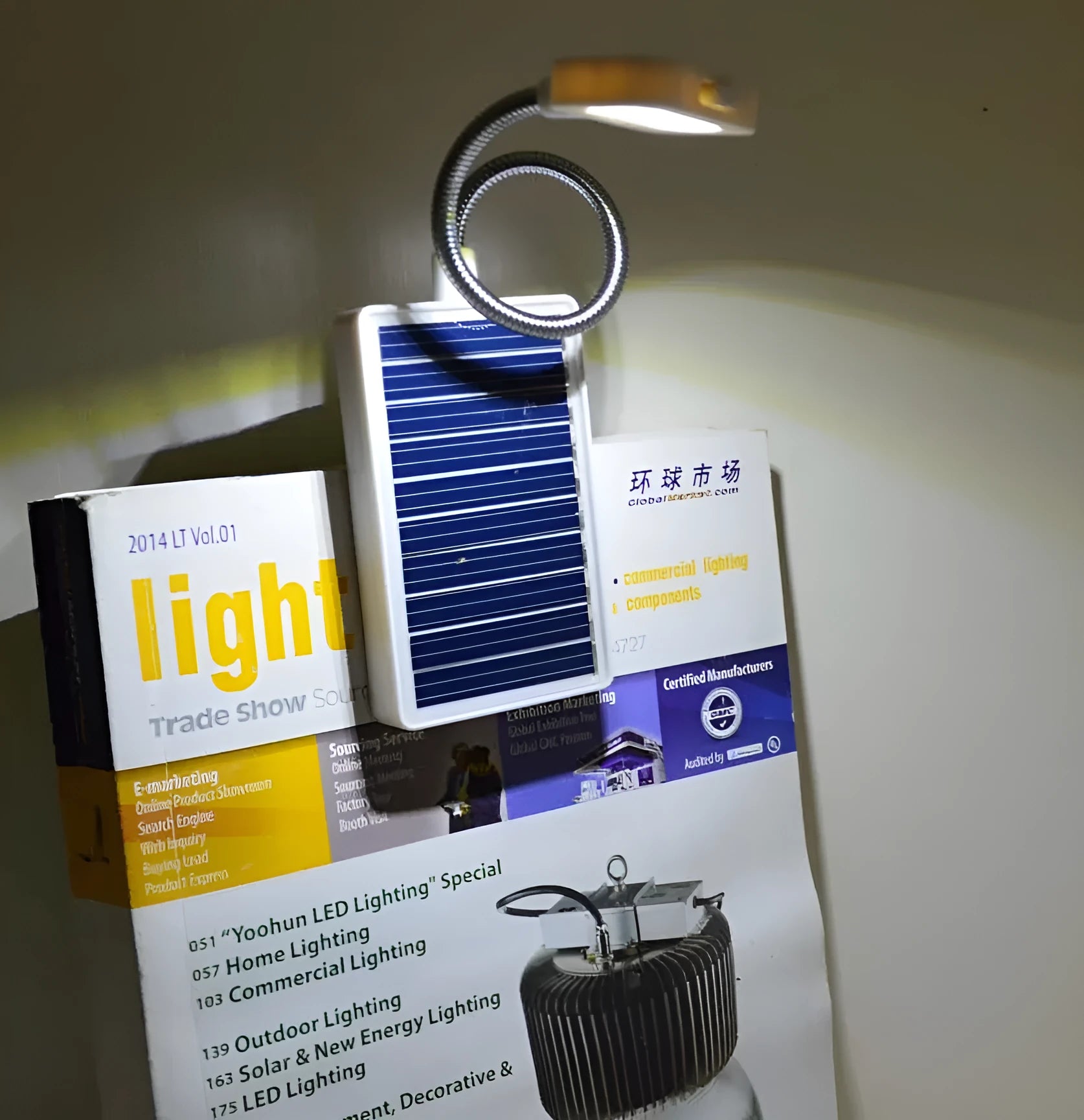 Solar garden light with plastic lampshade and LED illumination for outdoor pathways
