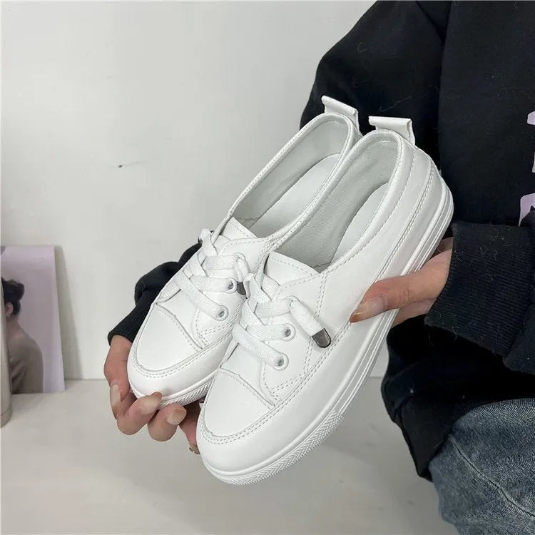 White women's sports breathable shoes with flat heel, round toe, lace-up front, and rubber sole