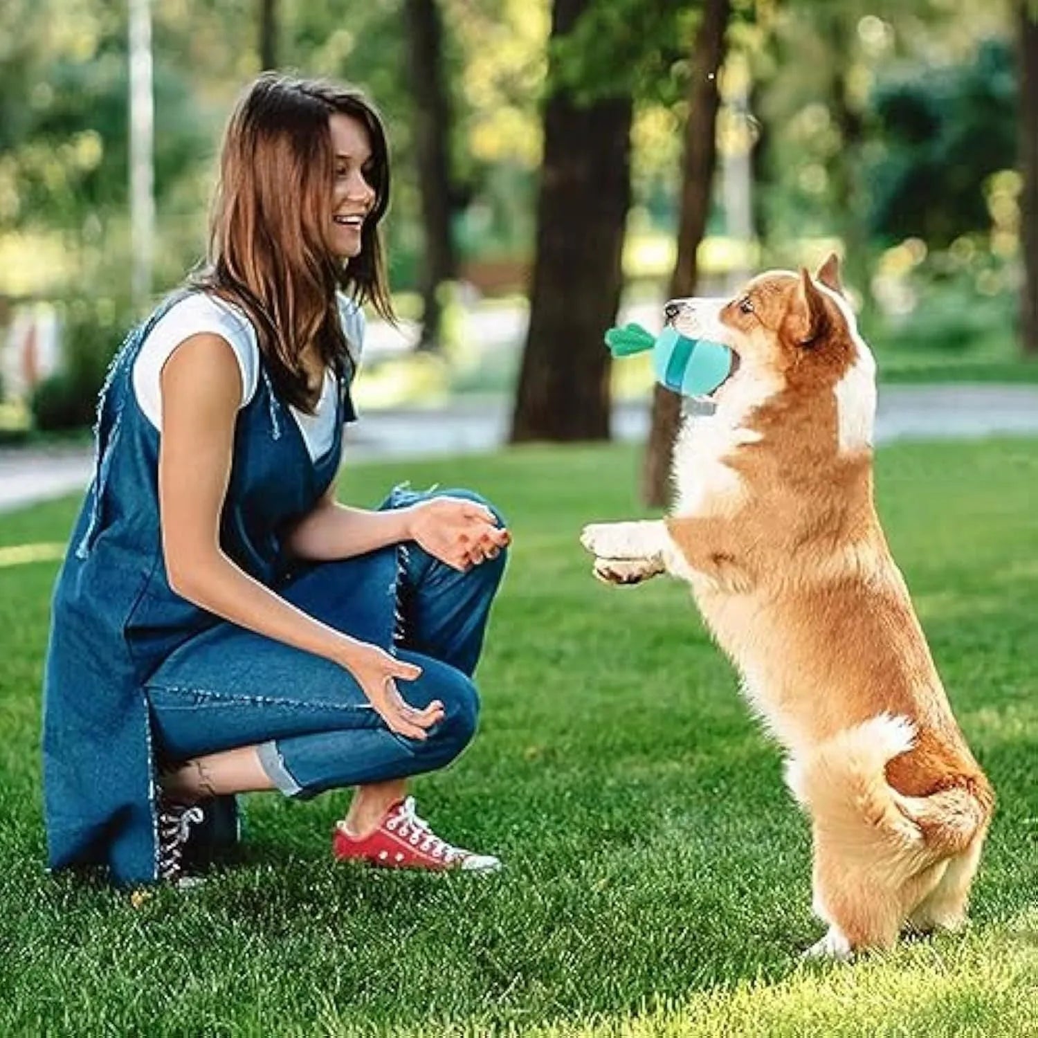 Blue durable rubber interactive dog treat puzzle ball for medium large dogs on a plain background