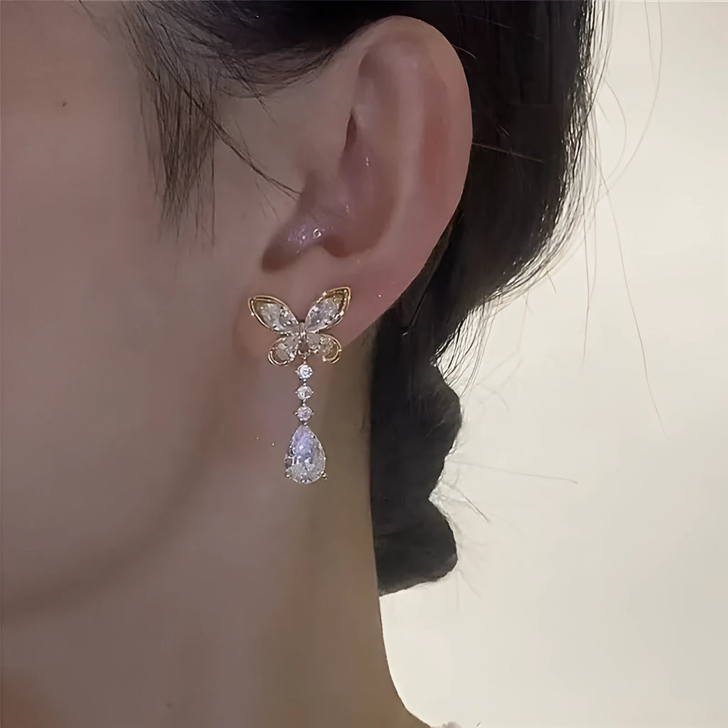 Platinum colour bow stud earrings with electroplated zinc alloy construction