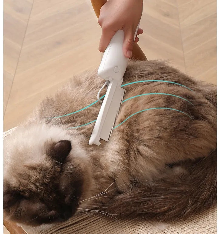 Pink and white ABS plastic pet grooming brush for dogs and cats on flat surface