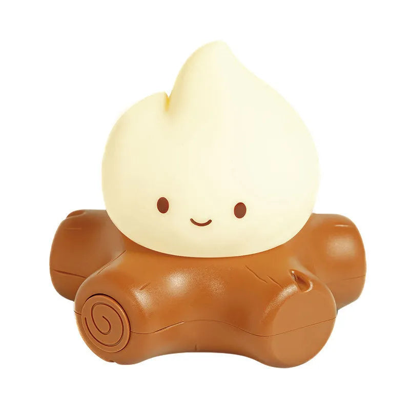 Cartoon-style small fire pile silicone night lamp with yellow light display on dark surface