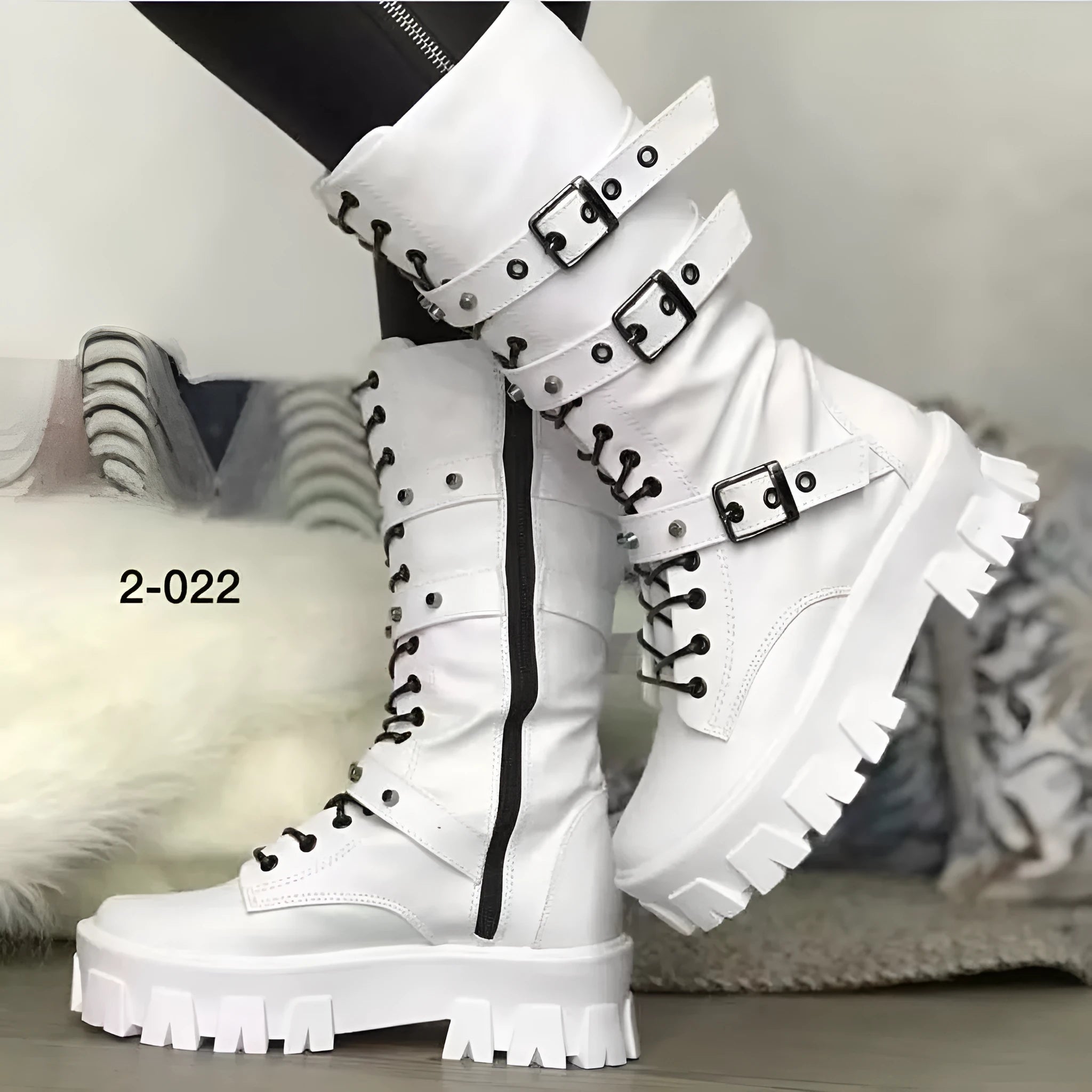 Women's black mid-calf knight boots with metal buckle detailing and side zipper