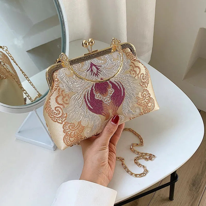Chinese embroidery cheongsam handbag in polyester with shell shape and internal zipper compartment