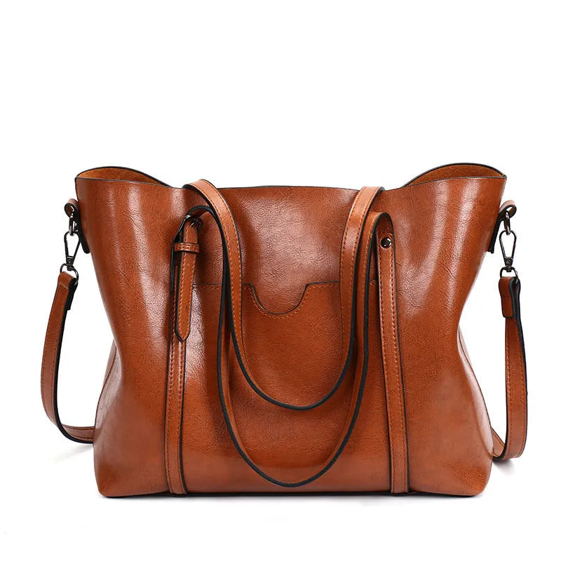 Brown retro-style women's PU leather messenger bag with a top handle and long shoulder strap.