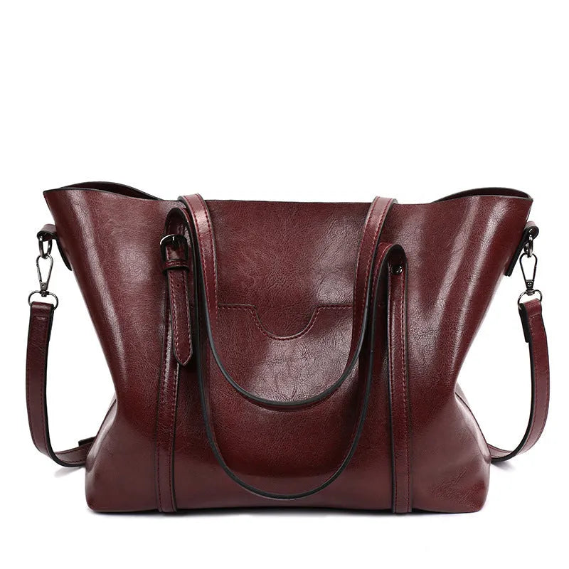 Brown retro-style women's PU leather messenger bag with a top handle and long shoulder strap.