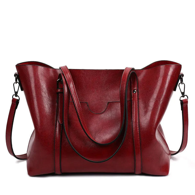 Brown retro-style women's PU leather messenger bag with a top handle and long shoulder strap.