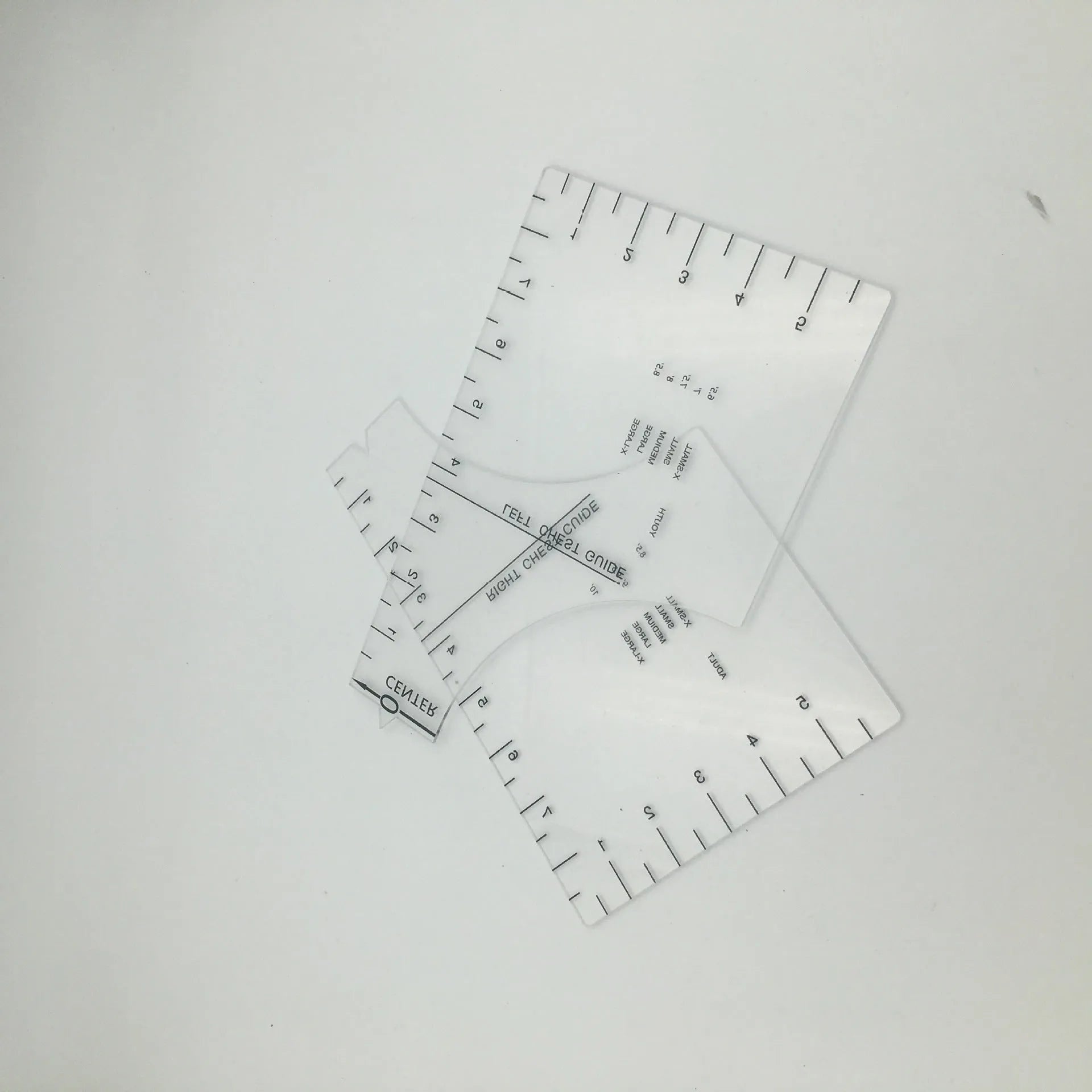 Transparent acrylic sewing patch ruler measuring 10x6 inches for T-shirt alignment and garment construction