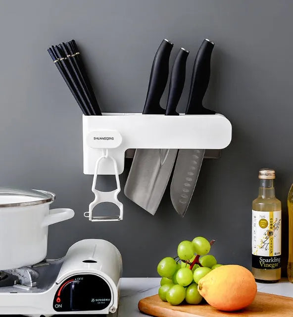 White plastic wall-mounted kitchen knife rack for utensil storage