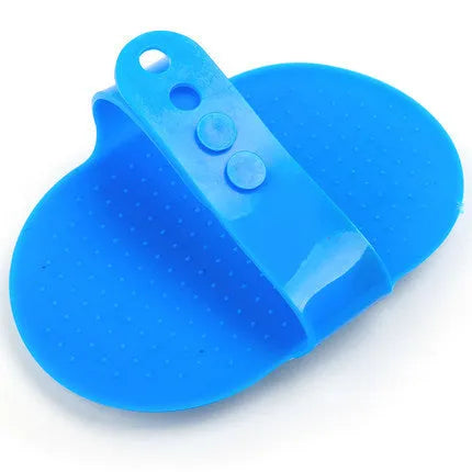 Elliptical hand-shaped plastic dog bath brush in blue, 120x90x20mm, for general pet grooming
