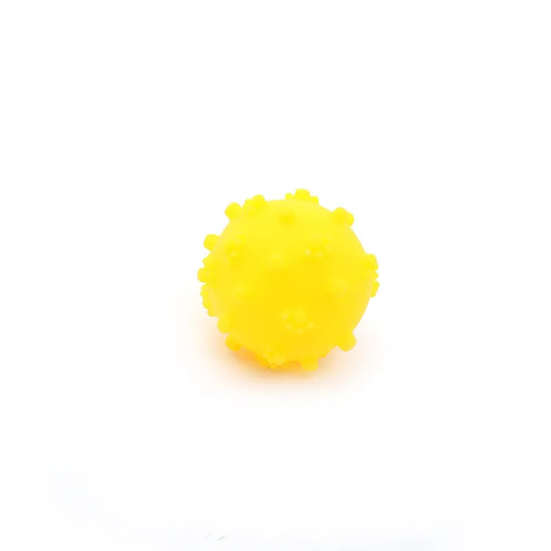 Set of four brightly coloured spiked dog balls with paw print dimples, each 5 cm in diameter