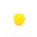 Set of four brightly coloured spiked dog balls with paw print dimples, each 5 cm in diameter