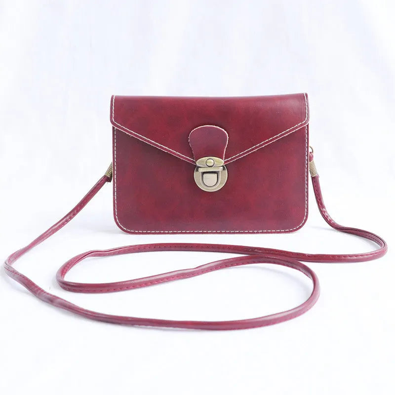 Retro shoulder messenger bag in wine red with flap closure and crossbody strap