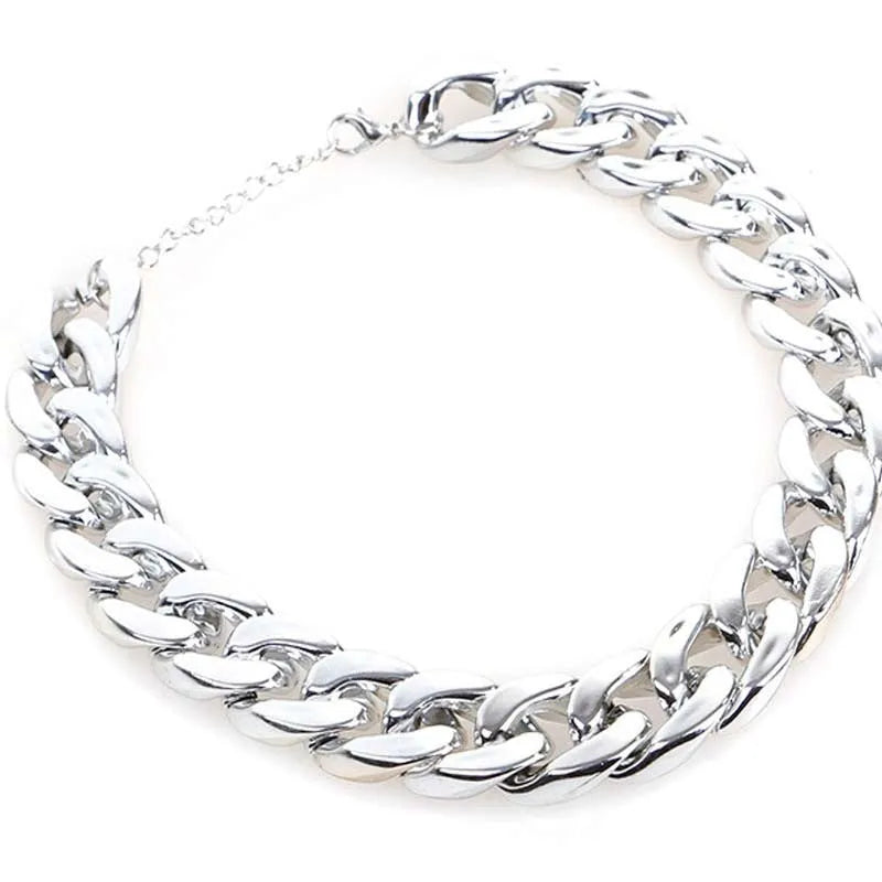 Geometric plastic resin dog collar chain necklace in gold or white on a small dog model