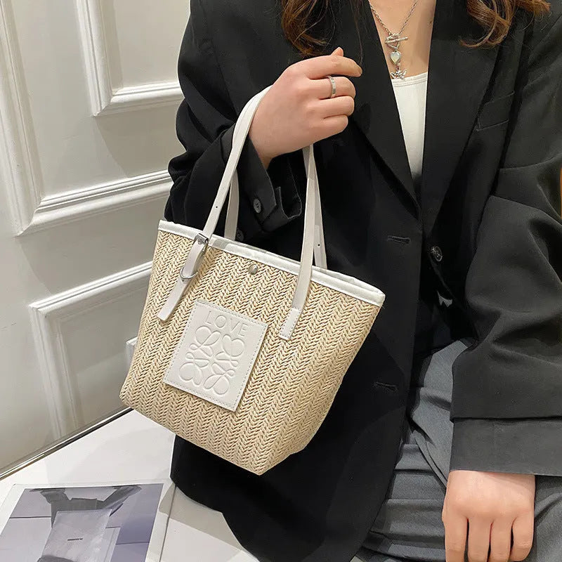 Women's retro style straw woven shoulder bag in black with large capacity and three-dimensional pocket