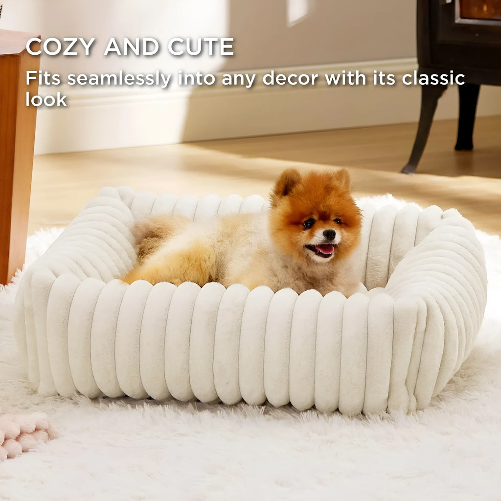 Rectangular orthopaedic dog bed with raised edges in beige colour showing high-density foam filling