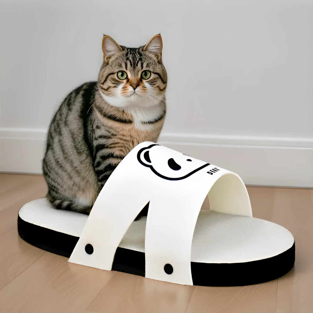 White corrugated paper cat scratch board in a slipper style design on a plain background.