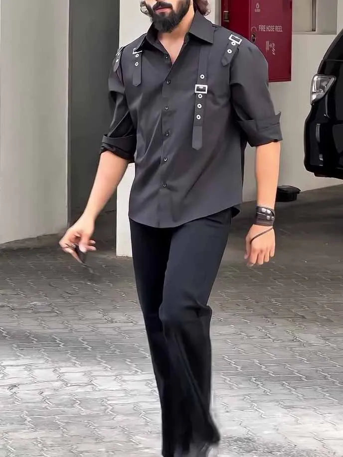 Man wearing a regular fit black polyester button-up utility shirt.