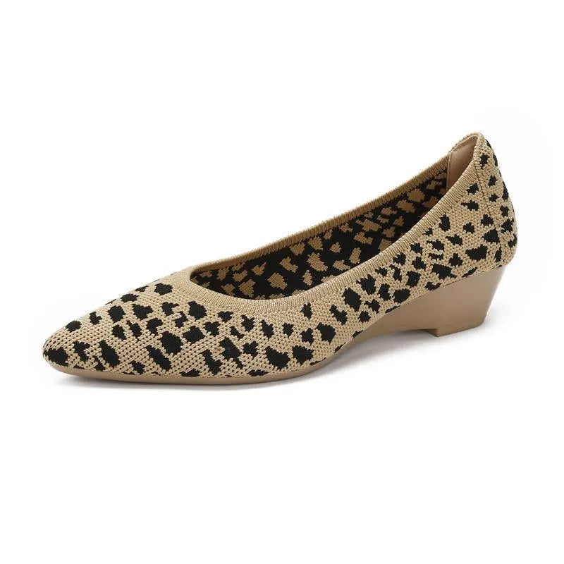 Women's pointed toe Flyknit wedge pumps in leopard print, showcasing low heel and mesh upper.