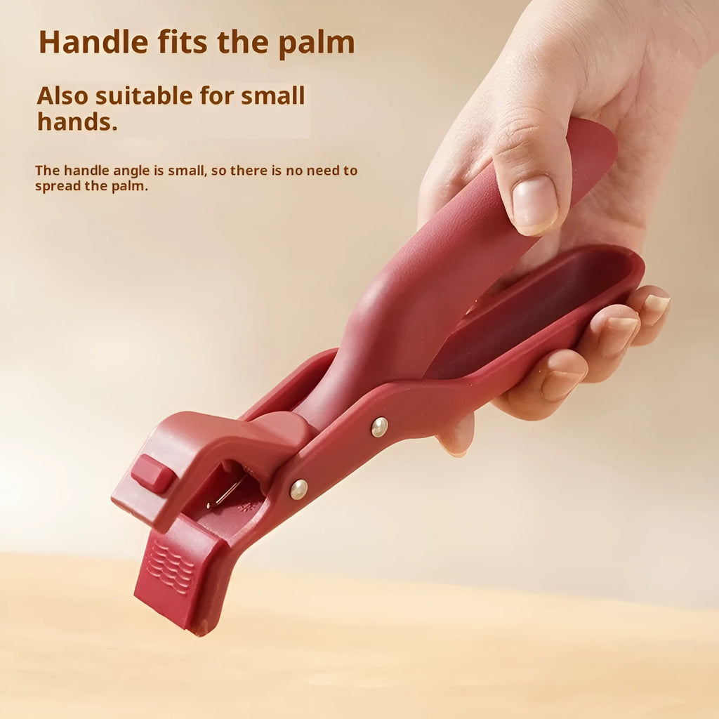 Carmine coloured anti-scalding clip with PP handle and silicone grip on kitchen counter
