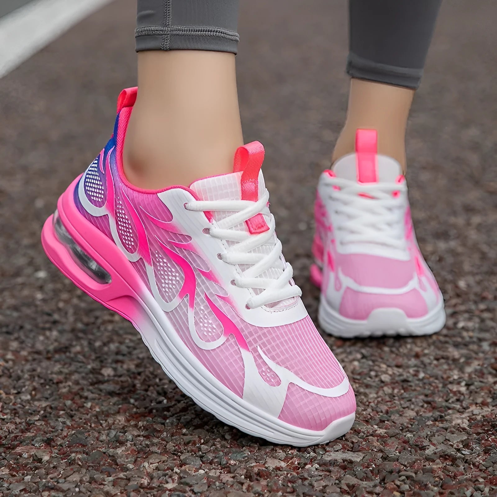 Women's pink mesh and PU sole casual sneaker shown from the side.