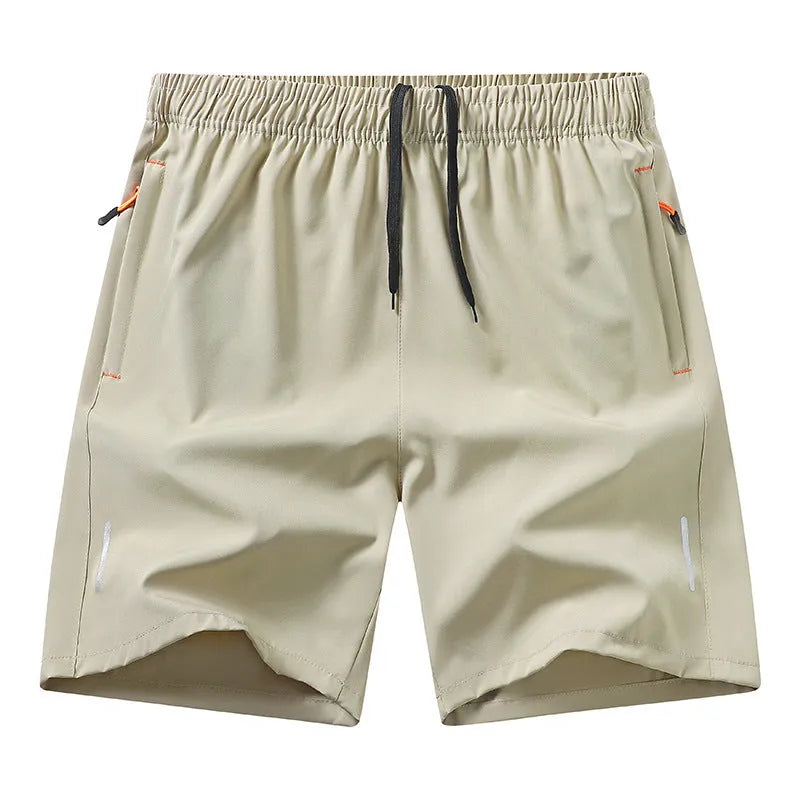 Man wearing loose-fit black ice silk basketball shorts for summer sports training.
