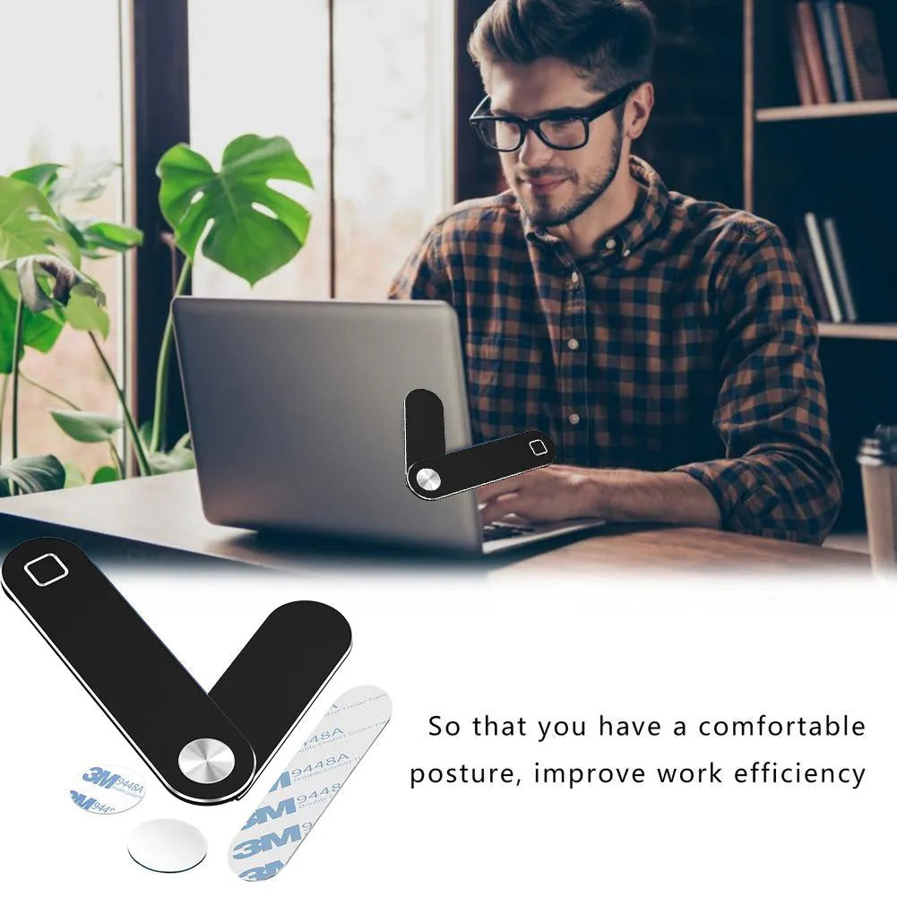 Black aluminium laptop phone holder with magnetic clip mounted to side of monitor
