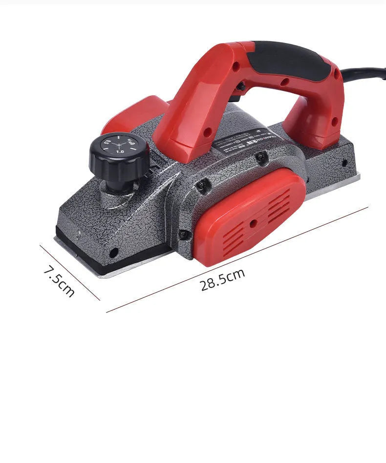 Red desktop electric wood planer with aluminium body, showing 82mm planing width and depth adjustment controls