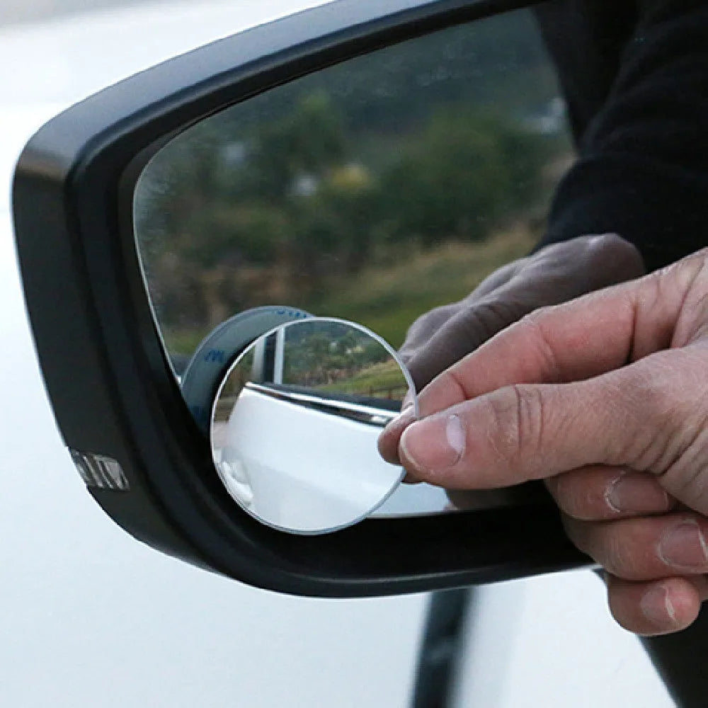 Silver round convex blind spot mirror with adjustable mount for car rearview mirror.