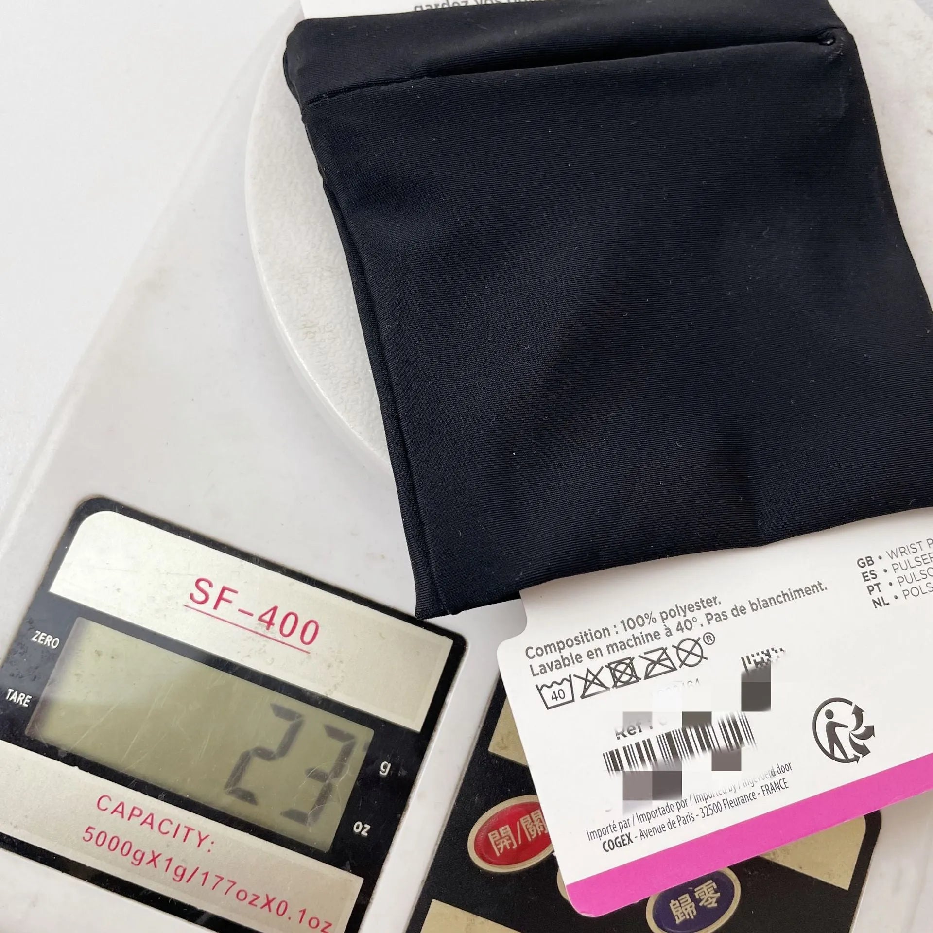 Compact black wrist armband bag for mobile phone, shown with dimensions 10cm by 10.5cm.