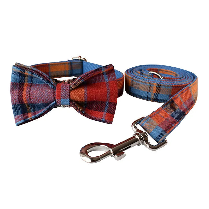 Blue background velvet plaid dog collar with a silver alloy buckle on a size tag.
