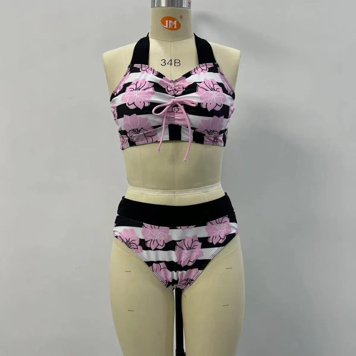 Black women's high-waisted bikini with belly coverage slimming design and split bottom style