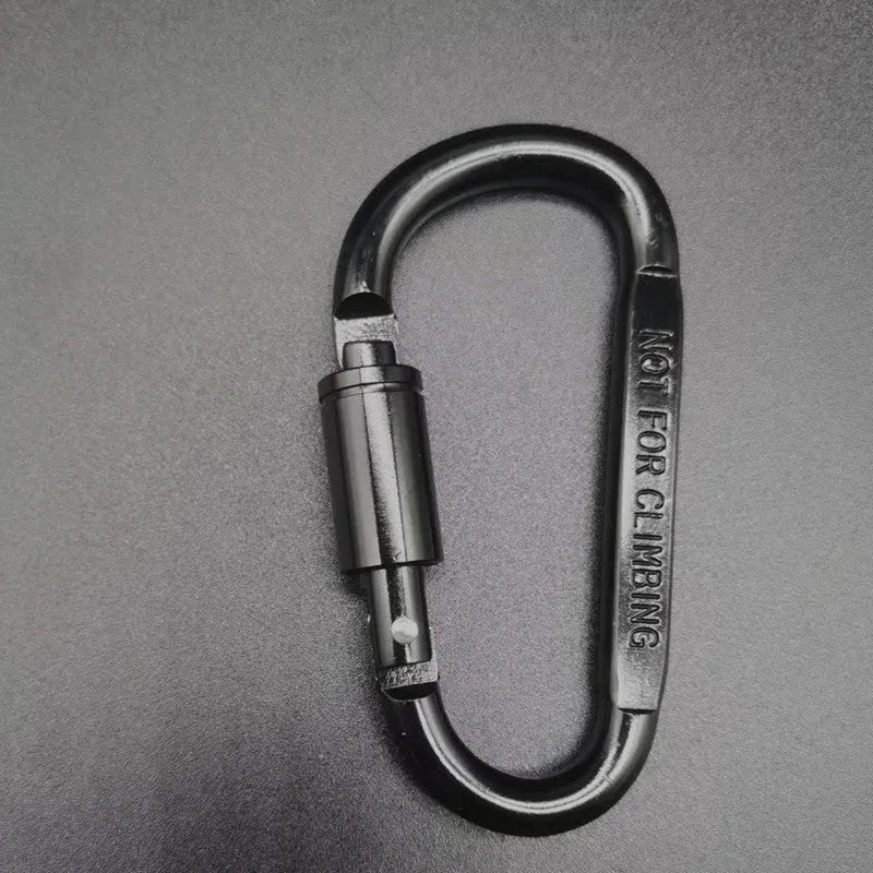 Silver D-shaped aluminium locking carabiner with an 8cm profile on a grey background.