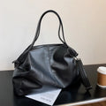 Soft surface messenger shoulder bag in horizontal square shape with zipper opening and internal compartments