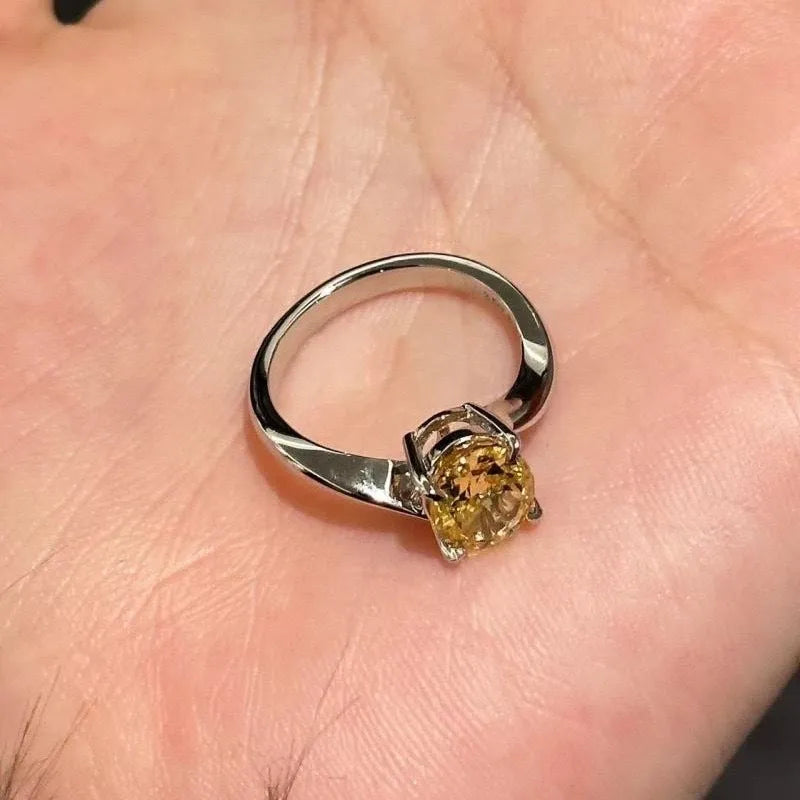 Women's yellow rock sugar copper ring on a neutral background showing bright yellow finish