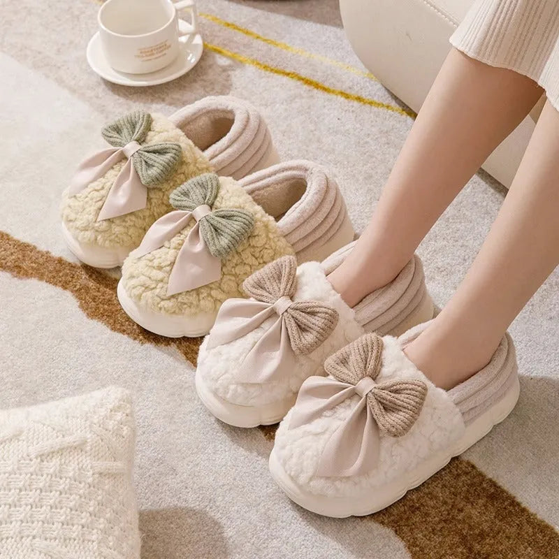 Big bow-knot fluffy slippers with covered heel in pink colour on floor